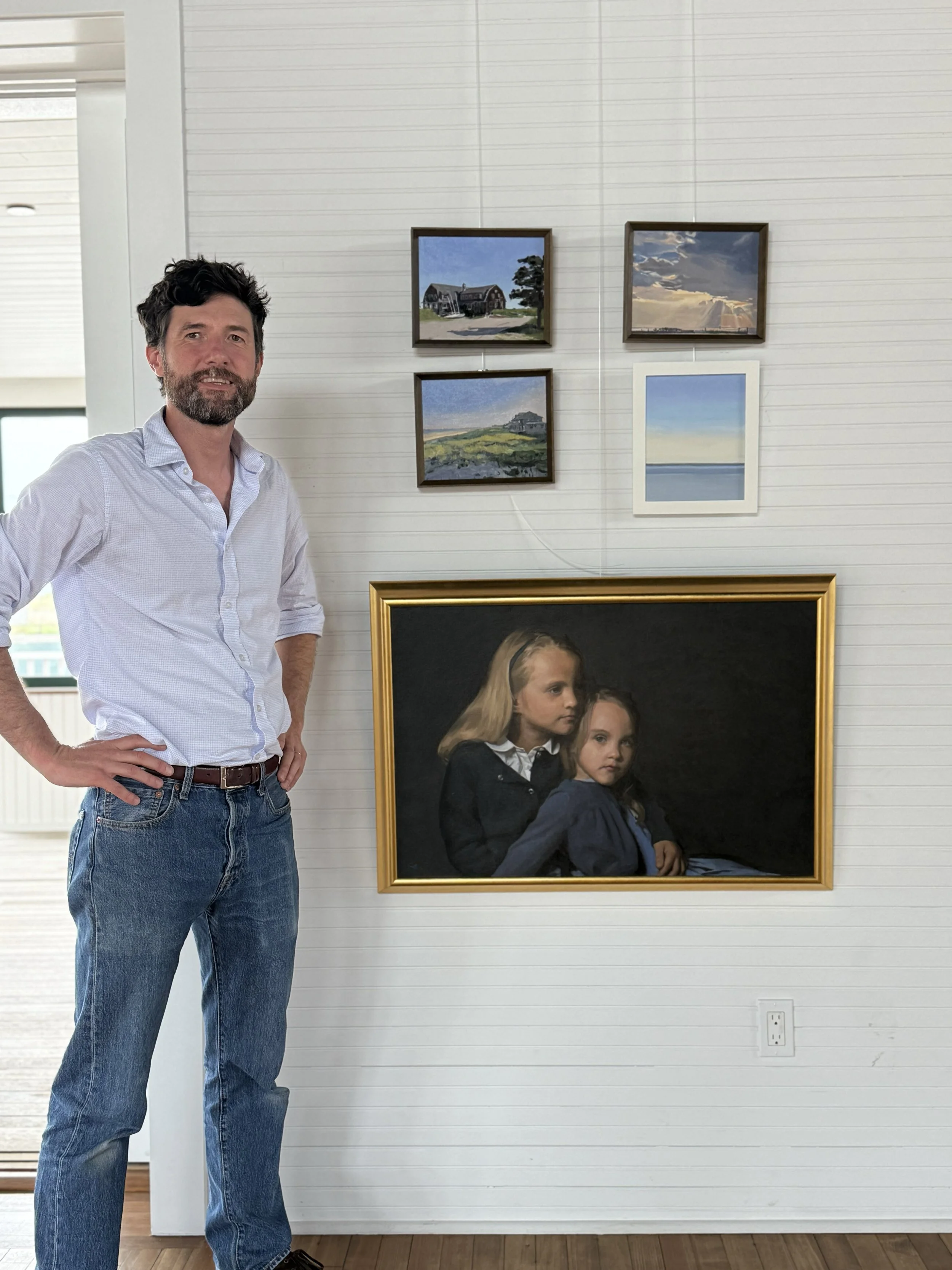Chris Eastland with his paintings